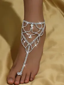 Sparkling rhinestone toe chain detail, elegant beach foot jewelry close up for summer.