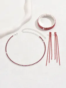 Exquisite red rhinestone jewelry set detail featuring choker necklace, bracelet and earrings.