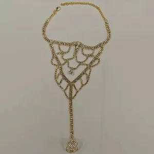 Elegant gold rhinestone foot chain anklet with toe ring, perfect for beach vacation style.