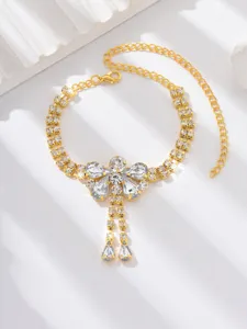 Gold rhinestone dragonfly butterfly anklet detail view, sparkling crystal beach foot jewelry.