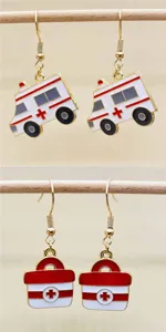 Close-up detail view of nurse theme alloy earrings featuring ambulance and first aid box items.