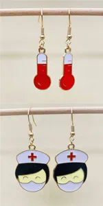 Detailed view of novelty medical themed enamel earrings featuring cute nurse and thermometer designs.