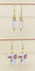 Novelty medical theme alloy dangle earrings featuring syringe and thermometer designs for daily wear.