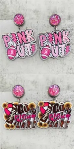 Detailed shot of sports themed wooden dangle earrings with pink ribbon and football design.
