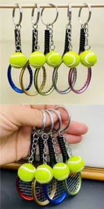 Mini tennis racket keychain, colorful metal sports key ring pendant for bags and gifts.