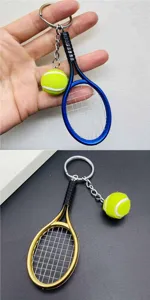 Close up of metal tennis racket and ball keychain pendant, sports enthusiast gift accessory detail