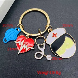Medical theme metal keychain with nurse, stethoscope, mask, and heart charms for nurse day.