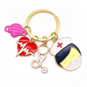 Medical nurse theme metal keychain with cute enamel charms including mask stethoscope and heart.