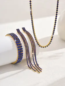Blue rhinestone claw chain jewelry set detail view, sparkling gold plated finish.