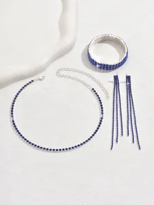 Detailed view of the blue rhinestone jewelry set featuring a necklace bracelet and earrings.