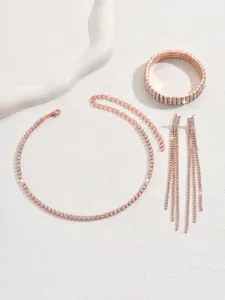 Rose gold rhinestone jewelry set featuring sparkling tennis necklace, bracelet, earrings.