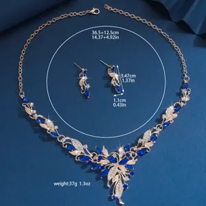 Elegante juego de collar y pendientes de cristal azul con acabado dorado noche.