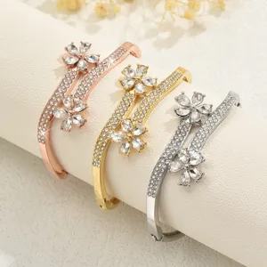 Exquisite crystal flower rhinestone metal bangle detail, elegant multi-color bracelet jewelry.