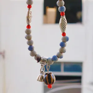 Chic retro ceramic beaded bracelet detail with lotus pod pendant, ethnic Chinese style jewelry.