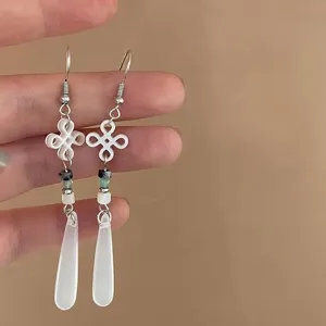 Chinese style jade teardrop tassel earrings detail shot, elegant new chinese jewelry.