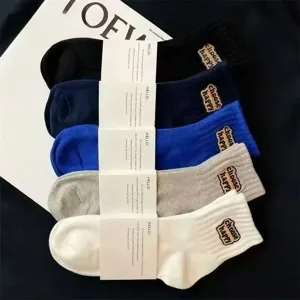 Classic cotton crew socks with happy embroidery, comfortable 7a antibacterial socks for daily wear.