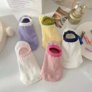 Detail shot of pastel macaron low cut boat socks featuring comfortable ribbed cuff design.