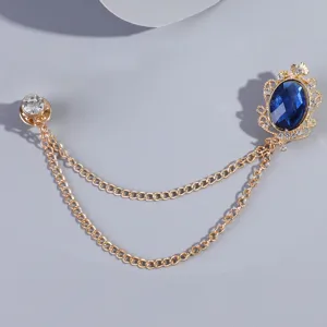 Vintage goudkleurige kettingbroche met blauwe ovale kristal en strass kraagspeld accessoire.