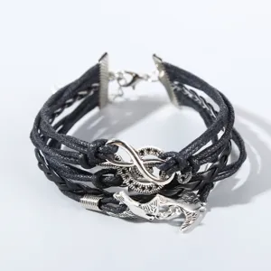 Handgemachtes mehrlagiges geflochtenes Lederarmband mit silbernem Unendlichkeits- und Vogelanhang.