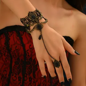 Bracelet de main en dentelle noire gothique vintage avec métal bronze antique et anneaux de gemmes