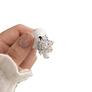 Sparkling snowflake crystal AirPods charm accessory, dazzling rhinestone earphone decoration.