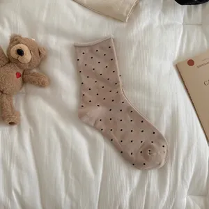 Beige polka dot mid-tube socks for women, cute rolled edge design, ins style daily wear.