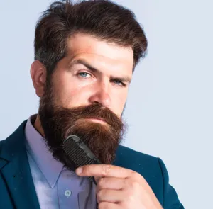 Detailed shot of a sleek black pocket comb being used for styling a beard effortlessly.