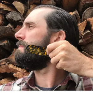 Detailed shot of an acetate beard comb with stylish marble tortoiseshell pattern for men and women.