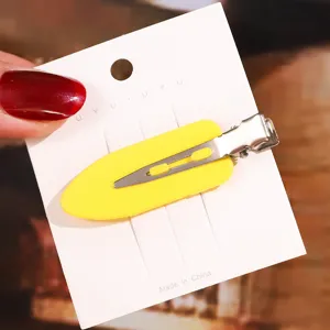 Yellow leaf shape duckbill hair clip detail shot, minimalist design for daily styling use.