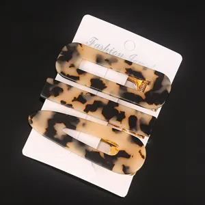 Set of 3 stylish tortoiseshell acetate hair clips with geometric designs for women.