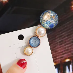 Korean style cute planet resin pearl hair clip detailed shot, elegant sweet side clip for daily wear.