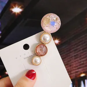 Korean style cute hair clip with sweet pearls and planet resin design for daily charming wear.