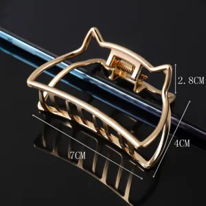 Detailed view of the gold cat ear metal hair claw clip, showing dimensions and alloy design.