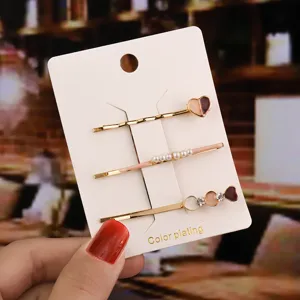 Joli ensemble de pinces à cheveux perle et cœur avec strass pour un style quotidien doux.