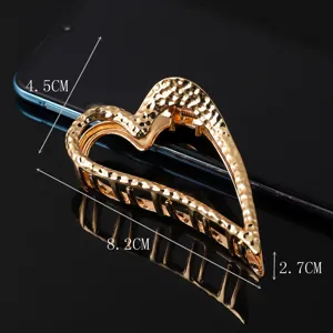 Elegant metal hair claw clip for women, large heart-shaped geometric design for daily styling.