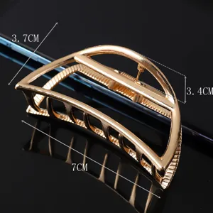 Minimalist gold metal hair claw clip, large alloy hollow design for elegant updos.