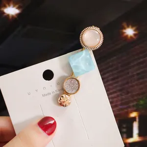 Korean style multi-element hair clip with pearl and glitter resin design for women fashion.