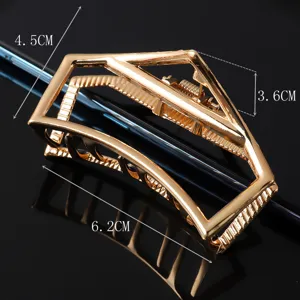 Gold metal hair claw clip with geometric hollow design, large size hair accessory for styling.