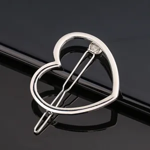 Silver heart metal hair clip detail, close up view of the polished alloy barrette design.