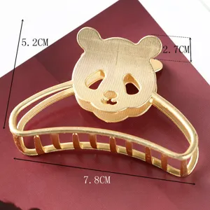 Gold metal hair claw clip featuring cute panda design, sturdy grip for daily styling and elegant updos.