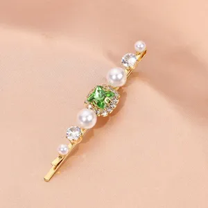Elegant gold hairpin featuring a sparkling green crystal, faux pearls, and clear rhinestones.