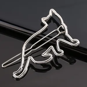 Metal cat hair clip detail, silver geometric hollow barrette, cute animal hair accessory close-up.