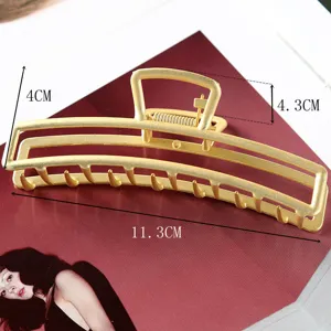 Large metal hair claw clip with hollow design for women, elegant daily hair styling tool.