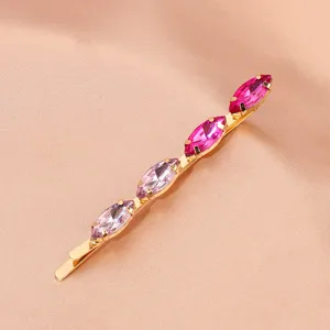Gold tone metal hair clip featuring sparkling pink and purple marquise rhinestones for women.