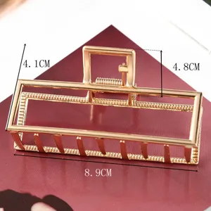 Gold geometric metal hair claw clip large size elegant hair accessory detail view