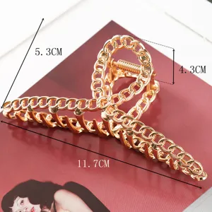Gold chain hair claw clip for women, large metal hair catcher, elegant styling accessory.