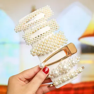 Close-up detail shot of elegant pearl hair clips set on a display card, exquisite and stylish.