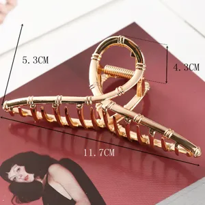 Large metal hair claw clip for women, stylish gold bamboo design hair accessory for daily updos.