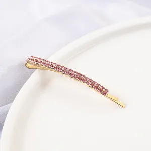 Closeup detail of the Korean style rhinestone bobby pin, showing delicate pink crystal stones.