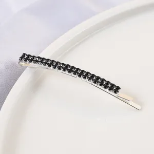 Close-up detail of a Korean style double row black rhinestone metal bobby pin hairpin accessory.